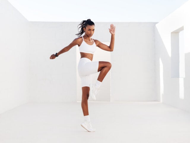 HIIT workout exercises. Woman is doing glute bridge.